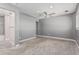 Spacious bedroom includes a ceiling fan, carpet, and a bathroom featuring gray tiling at 18 E Hermosa Dr # 18, Tempe, AZ 85282