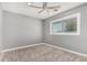 Carpeted bedroom with ceiling fan and window that provides natural light at 18 E Hermosa Dr # 18, Tempe, AZ 85282