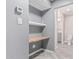 Hallway area with built-in desk with view to bathroom at 18 E Hermosa Dr # 18, Tempe, AZ 85282