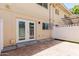 Private back patio features double doors and brick pavers, perfect for outdoor relaxing at 18 E Hermosa Dr # 18, Tempe, AZ 85282