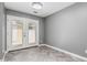 Neutral room featuring herringbone floors and double glass doors leading to a patio at 18 E Hermosa Dr # 18, Tempe, AZ 85282
