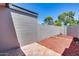 Enclosed backyard featuring a mix of tiled patio and mulch landscaping at 1822 W Marlette Ave, Phoenix, AZ 85015