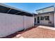 Enclosed backyard offers privacy with mulch landscaping and a small patio at 1822 W Marlette Ave, Phoenix, AZ 85015