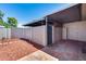 Private backyard space with tiled patio, mulch beds, and covered area at 1822 W Marlette Ave, Phoenix, AZ 85015