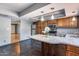 A modern kitchen design with granite countertops and stainless steel appliances at 1822 W Marlette Ave, Phoenix, AZ 85015