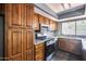 A stylish kitchen featuring stainless steel appliances and granite countertops at 1822 W Marlette Ave, Phoenix, AZ 85015