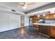 This living room boasts tile floors and connects to a kitchen with an island at 1822 W Marlette Ave, Phoenix, AZ 85015