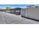 Carport parking area with a paved driveway and block wall surround at 1822 W Marlette Ave, Phoenix, AZ 85015