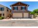 Charming two-story home with a three-car garage and well-maintained landscaping at 20565 W Terrace Ln, Buckeye, AZ 85396