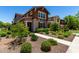 Charming two-story home with attractive landscaping, a welcoming walkway, and well-maintained exterior at 20565 W Terrace Ln, Buckeye, AZ 85396