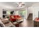 Bright living room showcases sleek wood flooring, a cozy seating area, and an open layout concept at 20565 W Terrace Ln, Buckeye, AZ 85396