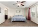 This main bedroom is bright and spacious, and features a large bed and an ensuite bathroom at 20565 W Terrace Ln, Buckeye, AZ 85396