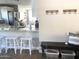 Stylish kitchen featuring a breakfast bar, stainless steel appliances, and ample counter space at 2100 N Normal Ave, Tempe, AZ 85288
