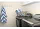 Functional laundry area featuring modern appliances and a convenient folding area at 2100 N Normal Ave, Tempe, AZ 85288