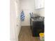 Well-organized laundry room with modern appliances, convenient storage, and ample space at 2100 N Normal Ave, Tempe, AZ 85288