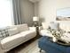Cozy living room featuring stylish sofas, a plush rug, and modern decor at 2100 N Normal Ave, Tempe, AZ 85288