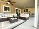 Comfortable outdoor patio with stylish furniture, ceiling fan, and access to the backyard at 2100 N Normal Ave, Tempe, AZ 85288