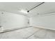 Spacious two car garage with bright lighting and modern door at 22343 S Manzanilla Rd, Buckeye, AZ 85326