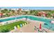 Resort-style community pool with lounge chairs, umbrellas, and plenty of space for recreation at 22515 E Sonoqui Blvd, Queen Creek, AZ 85142