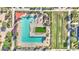 Community pool with multiple seating areas, lush green turf, and shaded lounge areas at 22515 E Sonoqui Blvd, Queen Creek, AZ 85142