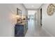 Inviting hallway with a decorative console table and a view of the open living space at 22515 E Sonoqui Blvd, Queen Creek, AZ 85142