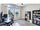 Office space with large arched windows, a desk, and a bookcase filled with books at 22515 E Sonoqui Blvd, Queen Creek, AZ 85142