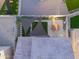 Aerial view of backyard featuring pavers, desert landscaping, and shade sails; perfect for outdoor relaxation and entertaining at 2361 N 212Th Dr, Buckeye, AZ 85396