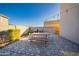 Sunny backyard features a built-in grill and a dining area under a shaded sky at 2361 N 212Th Dr, Buckeye, AZ 85396