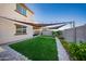 Expansive backyard features shade and manicured landscaping at 2361 N 212Th Dr, Buckeye, AZ 85396