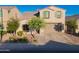 Charming two-story home featuring desert landscaping, neutral stucco, and a two car garage at 2361 N 212Th Dr, Buckeye, AZ 85396
