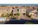 Well-maintained two-story home featuring manicured landscaping, a spacious driveway, and a neutral color palette exterior at 2361 N 212Th Dr, Buckeye, AZ 85396