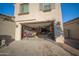 Spacious garage with two classic cars, ample storage, and well-lit workspace, ideal for car enthusiasts and hobbyists alike at 2361 N 212Th Dr, Buckeye, AZ 85396