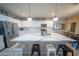 Bright, modern kitchen featuring white cabinets, quartz countertops and large island at 2361 N 212Th Dr, Buckeye, AZ 85396