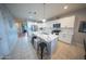Modern kitchen featuring white cabinets, a quartz countertop island, and stainless steel appliances at 2361 N 212Th Dr, Buckeye, AZ 85396