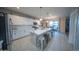 Bright, modern kitchen featuring white cabinets, quartz countertops and large island at 2361 N 212Th Dr, Buckeye, AZ 85396