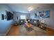 Living room showcases a plush sectional, wood floors, and a decorative area rug at 2361 N 212Th Dr, Buckeye, AZ 85396