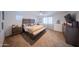 Main bedroom suite features a large bed, neutral carpet, and decorative accents at 2361 N 212Th Dr, Buckeye, AZ 85396