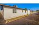 A low-maintenance backyard features a white-painted brick home exterior at 2508 N 58Th Ln, Phoenix, AZ 85035
