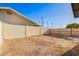 A spacious backyard features a block fence and potential for landscaping at 2508 N 58Th Ln, Phoenix, AZ 85035