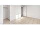 This bedroom has tile floors, a closet and a door at 2508 N 58Th Ln, Phoenix, AZ 85035