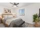 Cozy bedroom with natural light, neutral tones, and a ceiling fan at 2508 N 58Th Ln, Phoenix, AZ 85035