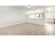 A bright living room featuring tile floors and a pass through to the kitchen at 2508 N 58Th Ln, Phoenix, AZ 85035