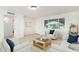 Cozy living room with neutral furniture, tile floors, and a large window providing natural light at 2508 N 58Th Ln, Phoenix, AZ 85035
