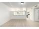 Living room featuring a large window, tile floors, and access to the kitchen at 2508 N 58Th Ln, Phoenix, AZ 85035