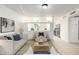 Living room featuring access to the kitchen and tile floors at 2508 N 58Th Ln, Phoenix, AZ 85035