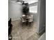 Cozy dining area featuring modern chandelier, dining table, and bright natural lighting at 2726 W Butler Dr, Phoenix, AZ 85051