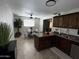 Open-concept kitchen flows into the dining area, featuring ample counter space and natural light at 2726 W Butler Dr, Phoenix, AZ 85051
