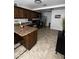 Well-equipped kitchen with stainless steel appliances, rich wood cabinetry, and granite countertops at 2726 W Butler Dr, Phoenix, AZ 85051