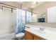 Bright bathroom featuring a tub and shower, vanity sink, and neutral finishes for a clean and inviting space at 3041 E Fremont Rd, Phoenix, AZ 85042