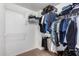Walk-in closet providing ample storage with built-in shelving and rods for organized clothing and accessories at 3041 E Fremont Rd, Phoenix, AZ 85042